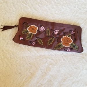 Beaded embroidered flowers on brown satin clutch